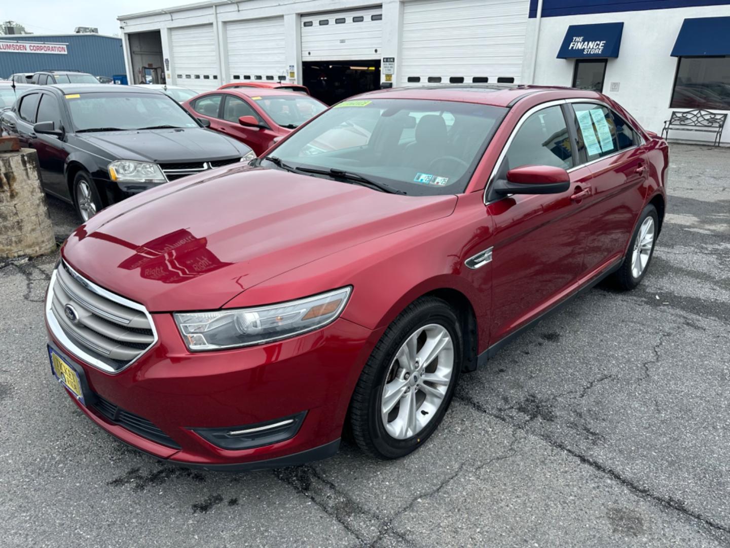 2013 RED Ford Taurus SEL FWD (1FAHP2E8XDG) with an 3.5L V6 DOHC 24V engine, 6-Speed Automatic transmission, located at 1254 Manheim Pike, Lancaster, PA, 17601, (717) 393-9133, 40.062870, -76.323273 - Photo#0